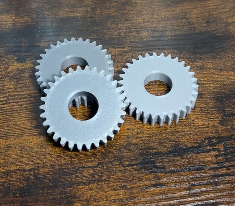 Three custom 3D-printed spur gears