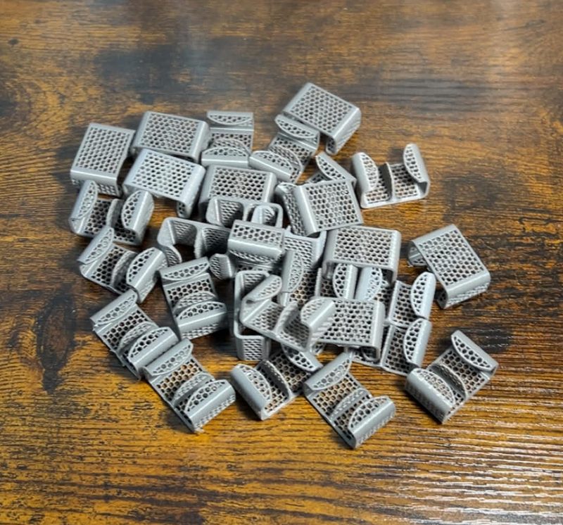 A batch of 15 simple 3D-printed cable organizers